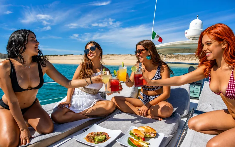 Guests celebrating on a luxury yacht charter in Cabo San Lucas