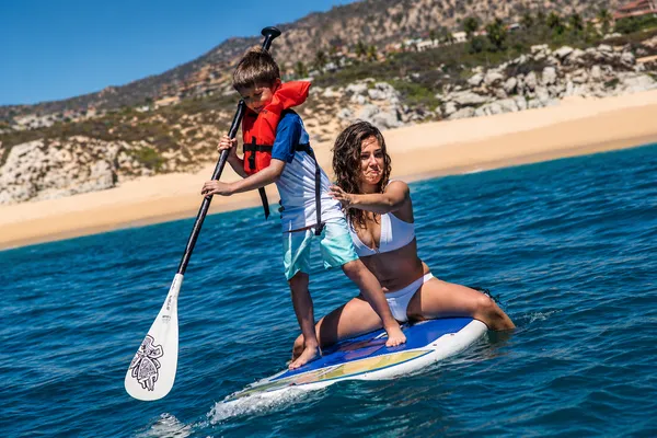 Paddleboarding adventure on a sunny beach
