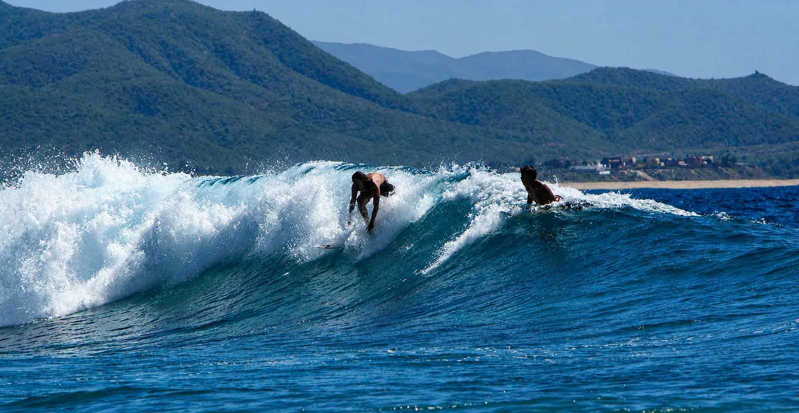 Surfer riding a wave along the Los Cabos coast